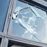 Broken,Glass,Window,Reflecting,Blue,Sky