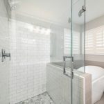 Bathroom,Interior,With,Frameless,Shower,Stall,And,Freestanding,Bathtub.,Stall