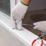 Construction,Worker,Repairing,The,Sliding,Window.,Open,Cap,Of,Adjust