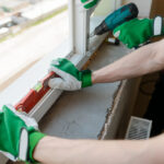 Hands,Holding,A,Level,Tool.,Construction,Workers,Are,Installing,A